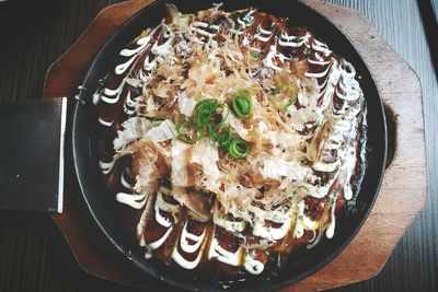 High angle view of okonomiyaki served in plate