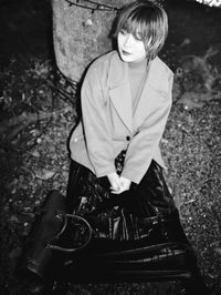 High angle view of woman sitting outdoors