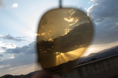 Close-up of wall against cloudy sky