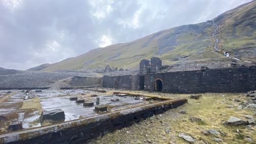 View of old building against cloudy sky