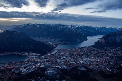 Aerial view of sea and mountains against sky