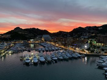 Cabo san lucas marina at sunset after a busy day the many boats and yachts moored up 