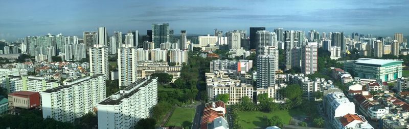 High angle view of modern buildings in city against sky