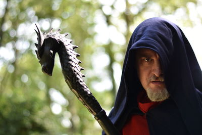 Portrait of mature man wearing hood outdoors