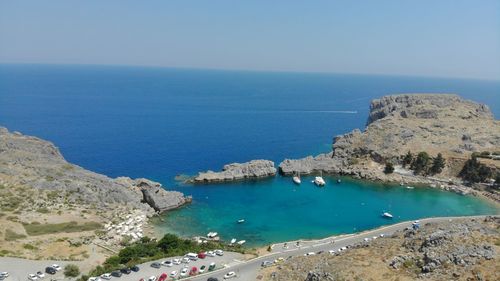 High angle view of swimming pool by sea against clear sky
