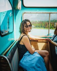 Midsection of woman sitting in bus