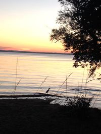 Scenic view of sea against sky at sunset