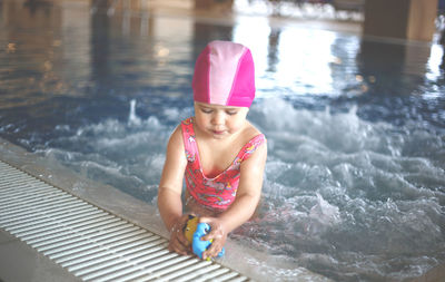 Full length of girl swimming in pool