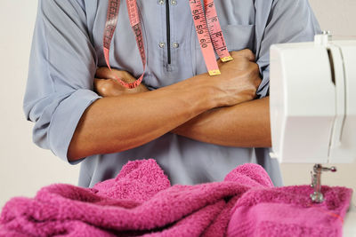 Midsection of man and woman sitting at home