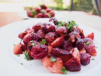 Close-up of strawberries in plate on table
