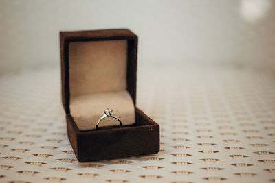 Close-up of wedding rings on table