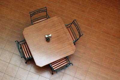 High angle view of chairs and table at home