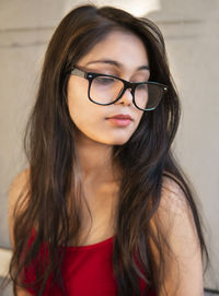 Close-up of young woman looking down