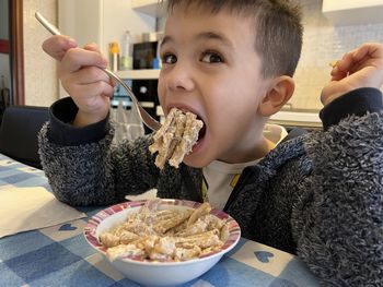 Close-up of boy eating food