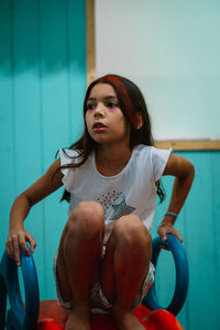 Portrait of girl about to slide