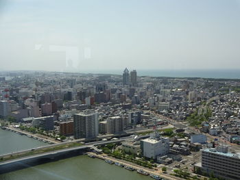 High angle view of buildings in city against sky