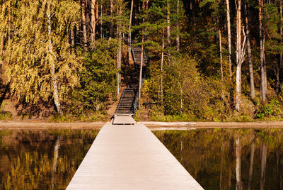 Wooden pier and wooden staircase on lake baltieji lakajai in labanoras regional park, lithuania