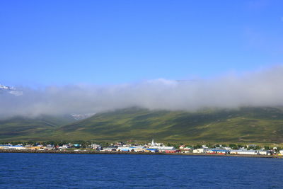 Scenic view of sea against blue sky