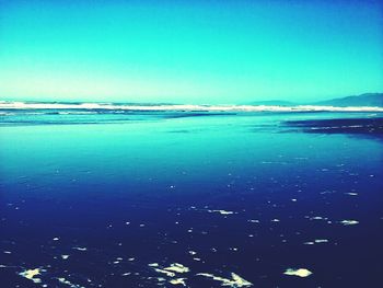 Scenic view of calm sea against clear sky