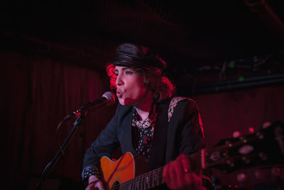 Guitarist performing at a nightclub