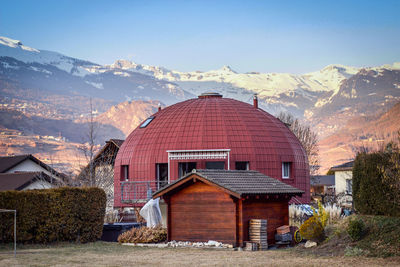 Houses and buildings against sky