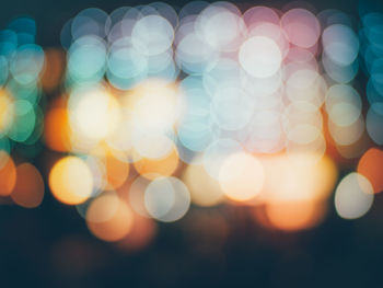 Defocused image of illuminated lights at night