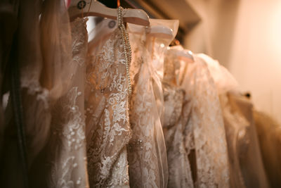 Close-up of clothes hanging on rack at store