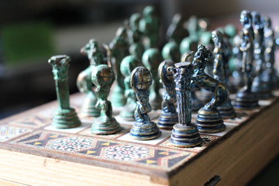 Close-up of chess pieces on book