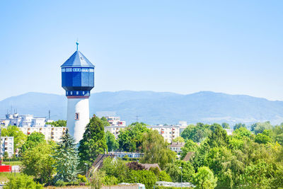 View of townscape against clear blue sky