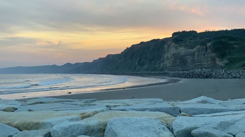 Scenic view of sea against sky during sunset