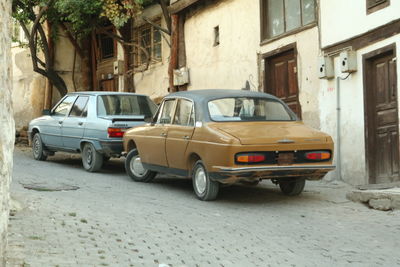 Car parked on street by building