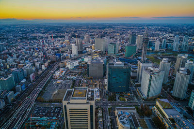 High angle view of modern buildings in city against sky