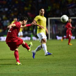 Low angle view of playing soccer ball on field