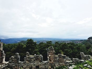 Scenic view of landscape against cloudy sky