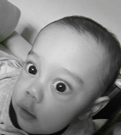 Close-up portrait of cute baby at home