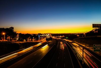 High angle view of light trails on highway at night