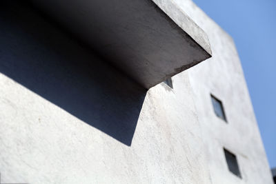 Low angle view of building against blue sky