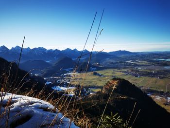 Scenic view of mountains against clear blue sky