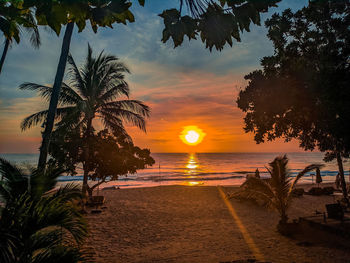Scenic view of sea against sky at sunset