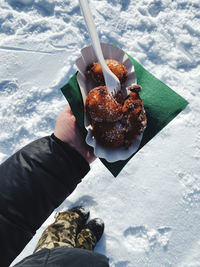 High angle view of person holding ice cream