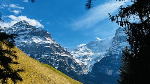 Scenic view of snowcapped mountains against sky