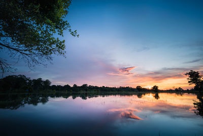 Scenic view of lake against sky during sunset