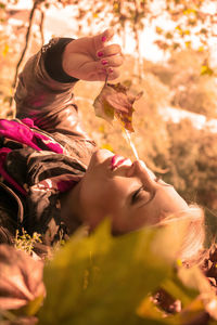 Portrait of woman with pink flowers