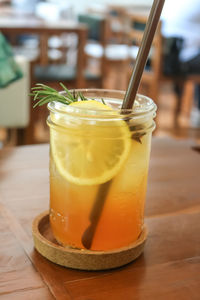 Close-up of drink in jar on wooden table
