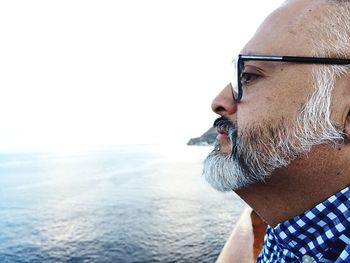 Thoughtful man looking at sea