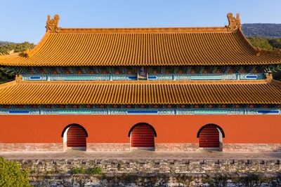 Exterior of temple building against clear sky