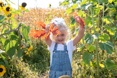 Full length of girl standing on plant