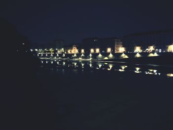 Reflection of illuminated buildings in water