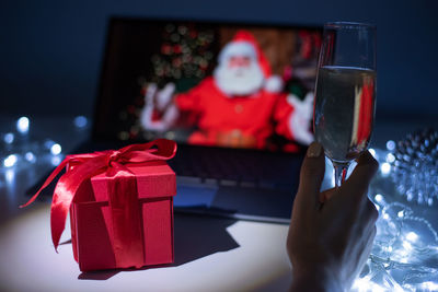 Midsection of person holding christmas decoration in box