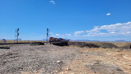 Train on land against blue sky